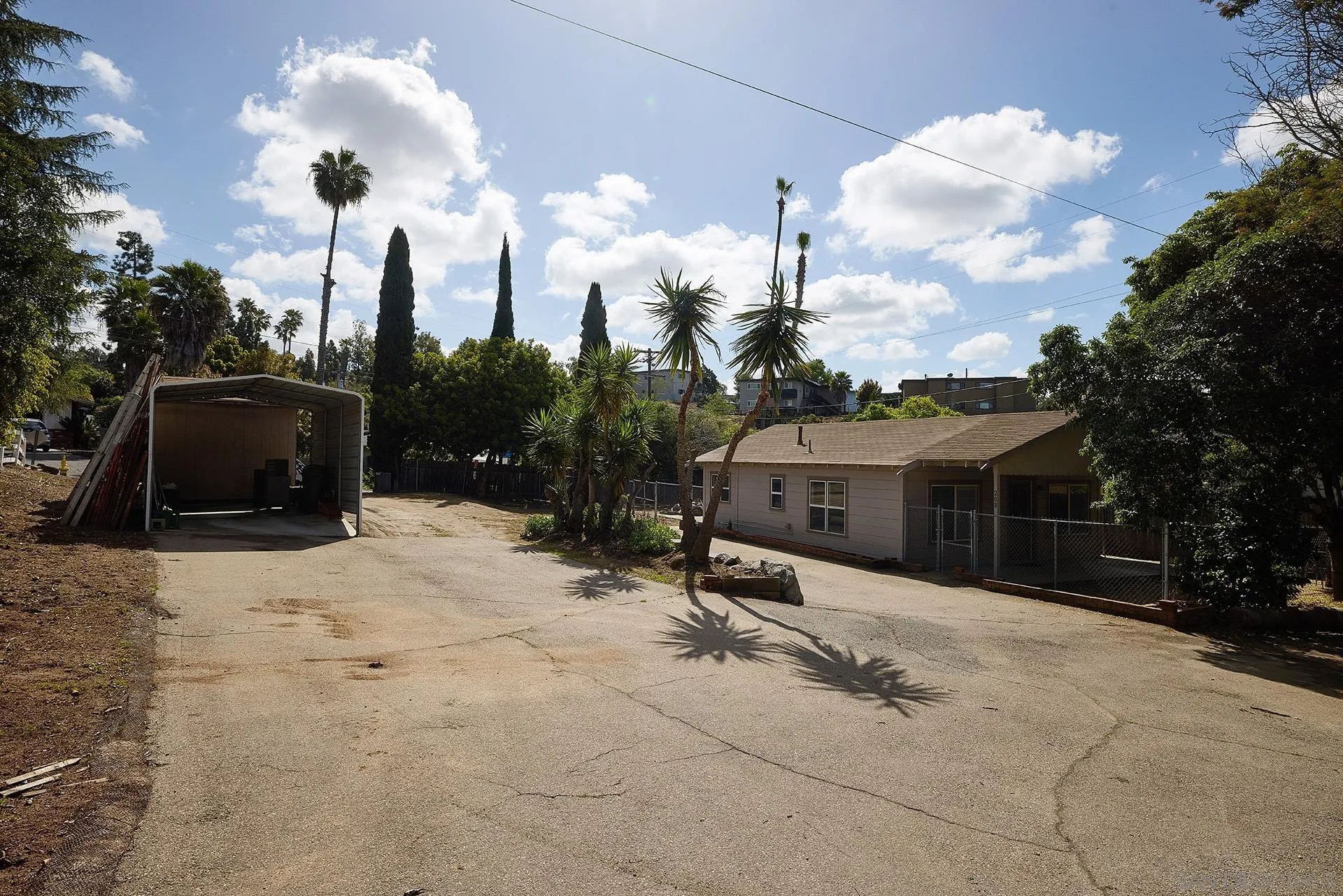 208 Avalon Drive Vista, CA 92084 - Photo 22 of 30 a front view of a house with a yard and garage