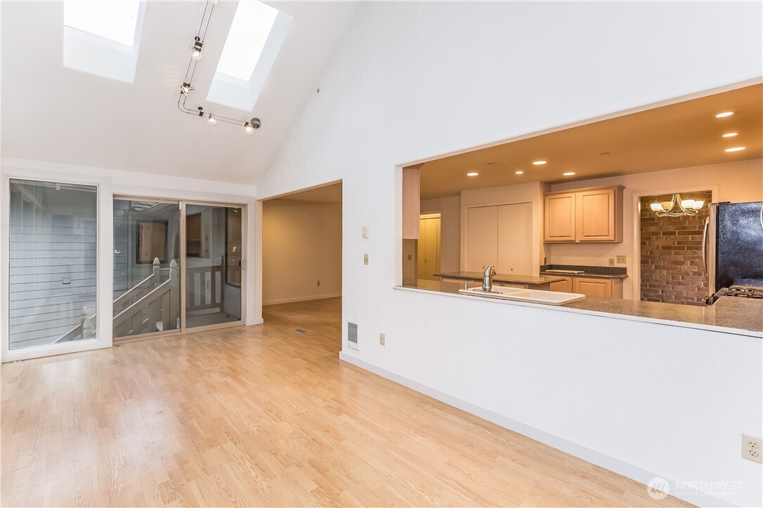 2 Cascade Key Bellevue, WA 98006 - Photo 11 of 24 a view of a big room with wooden floor and windows