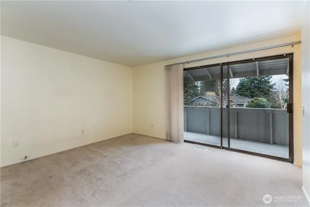 an empty room with sliding door