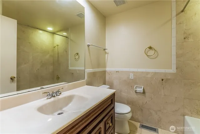 a bathroom with a sink and toilet