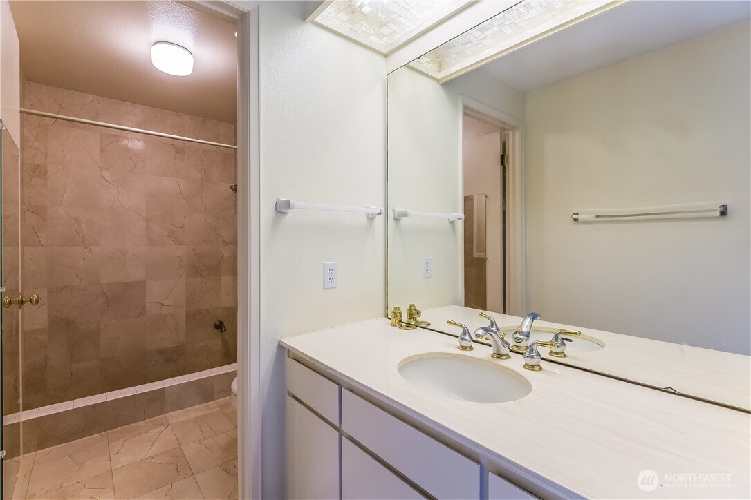 2 Cascade Key Bellevue, WA 98006 - Photo 15 of 24 a bathroom with a sink shower and a mirror