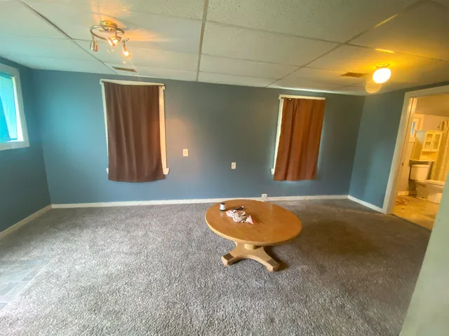 a wooden bench sitting in a room