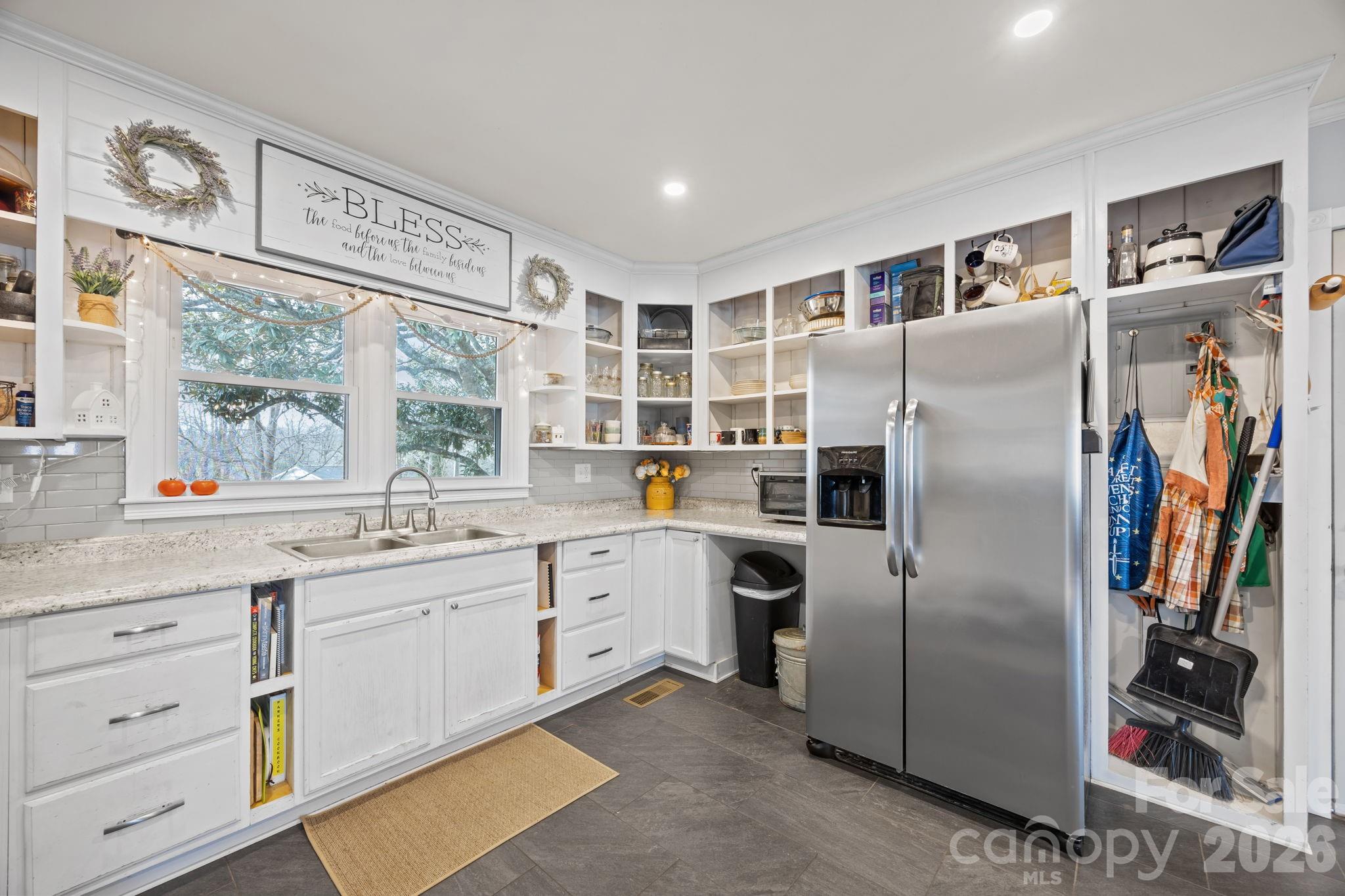 275 Tanner Street Rutherfordton, NC 28139 - Photo 28 of 44 a kitchen with stainless steel appliances a refrigerator sink and cabinets
