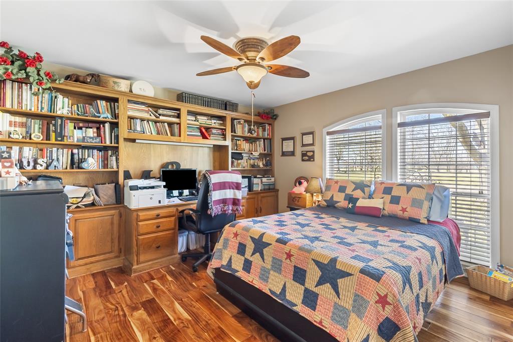 412 Pipeline Road Sulphur Springs, TX 75482 - Photo 17 of 40 Downstairs bedroom with built-ins and closet.