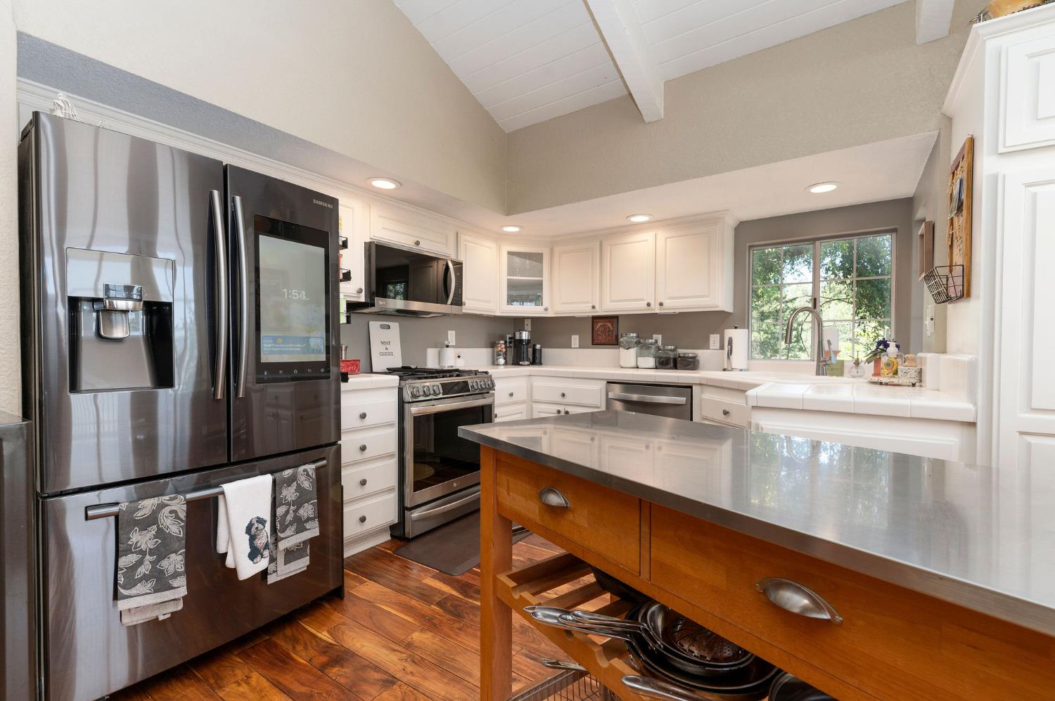 11266 Clinton Bar Road Pine Grove, CA 95665 - Photo 14 of 77 a kitchen with stainless steel appliances granite countertop a refrigerator a stove and a sink with wooden floor