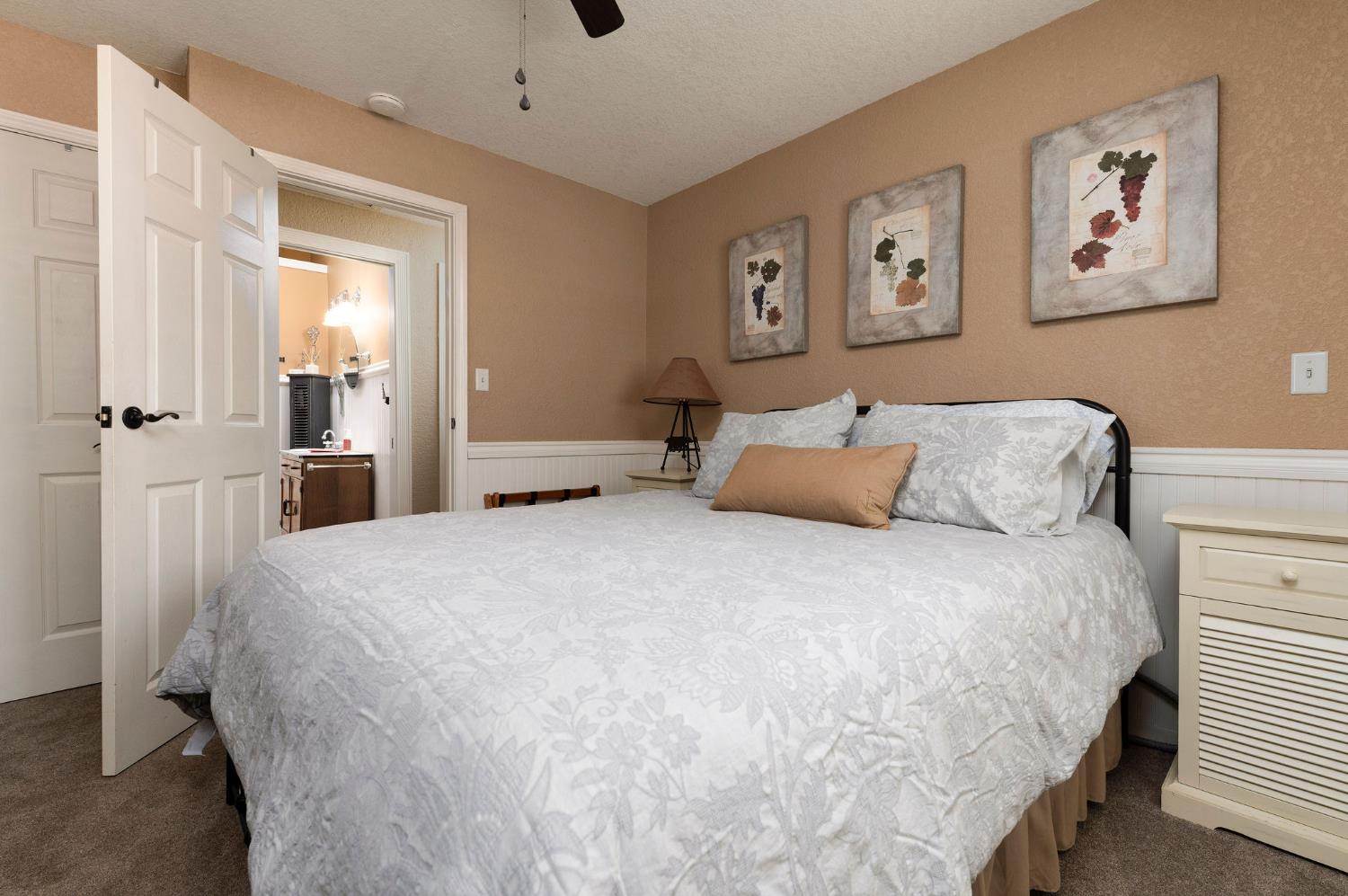 11266 Clinton Bar Road Pine Grove, CA 95665 - Photo 23 of 77 a large bed sitting in a bedroom and a table