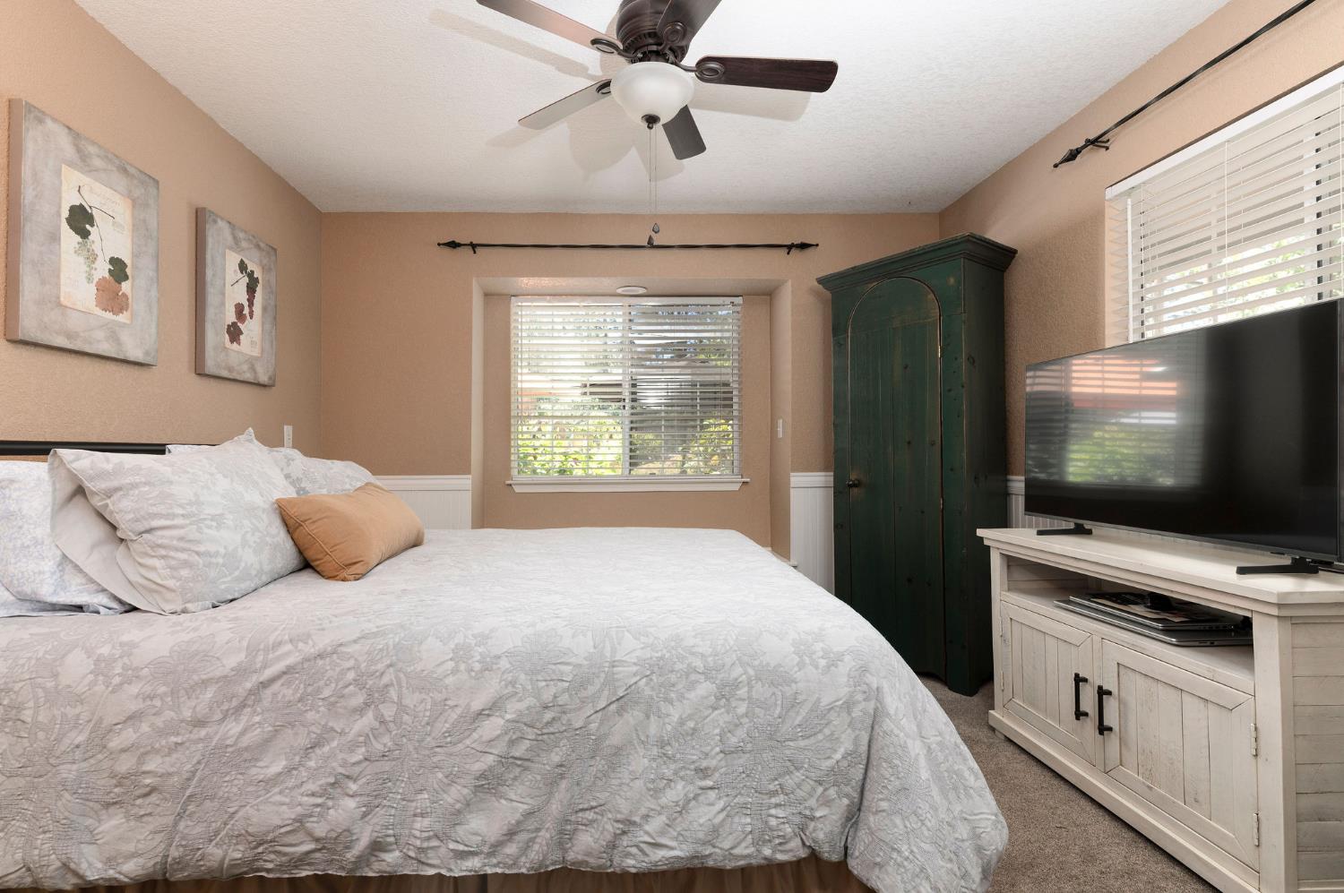 11266 Clinton Bar Road Pine Grove, CA 95665 - Photo 25 of 77 a bedroom with a bed and a flat screen tv