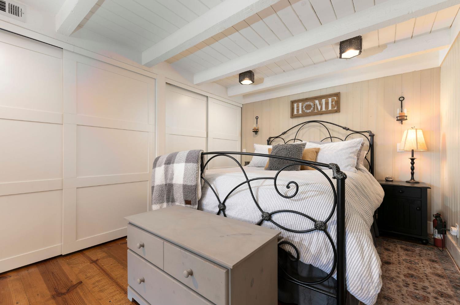 11266 Clinton Bar Road Pine Grove, CA 95665 - Photo 29 of 77 a bedroom with a bed and a table in it