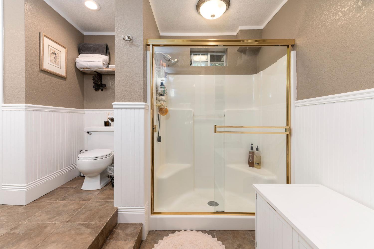 11266 Clinton Bar Road Pine Grove, CA 95665 - Photo 30 of 77 a bathroom with a sink toilet and shower