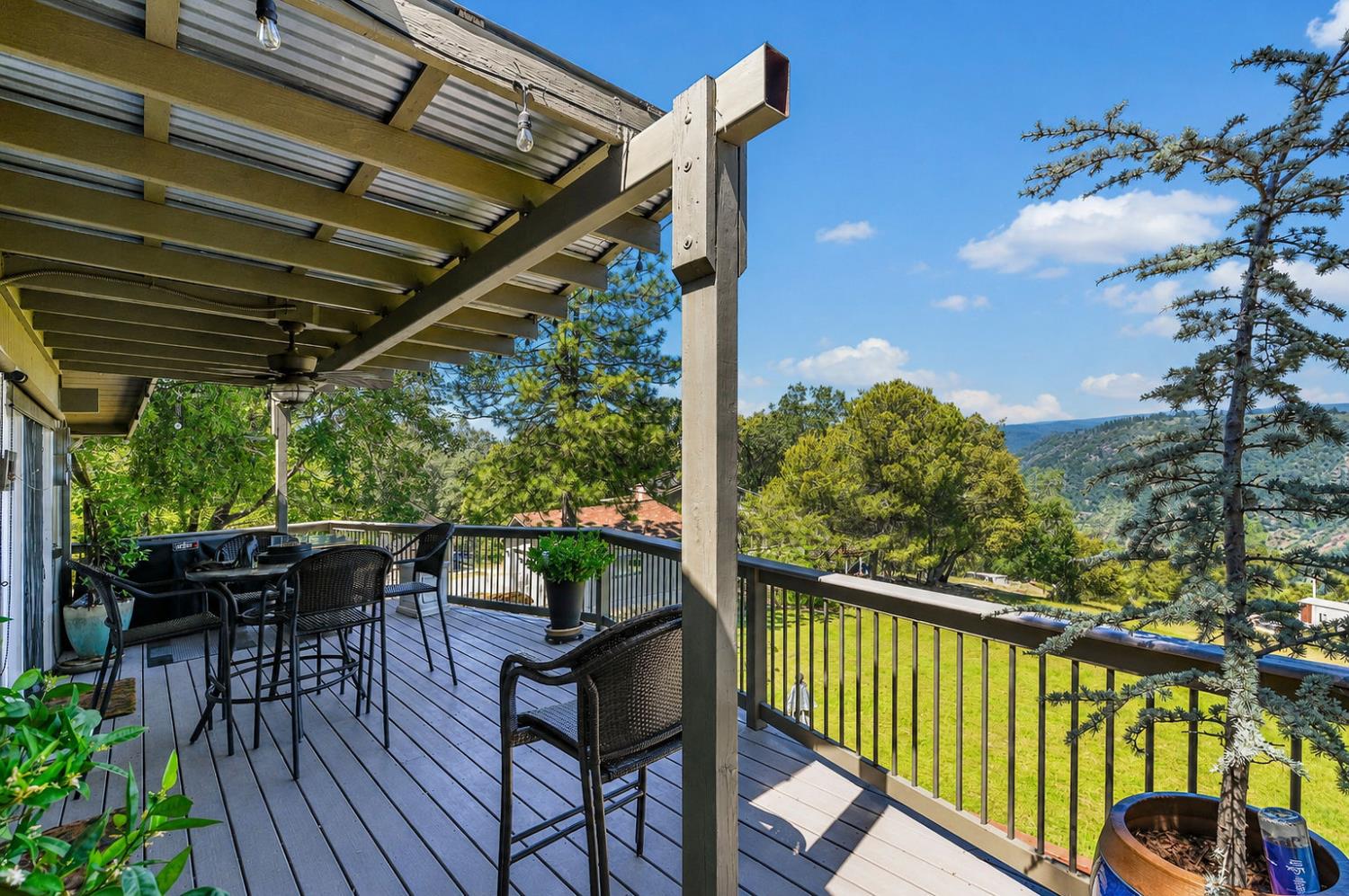 11266 Clinton Bar Road Pine Grove, CA 95665 - Photo 5 of 77 a view of a chairs and table in the balcony