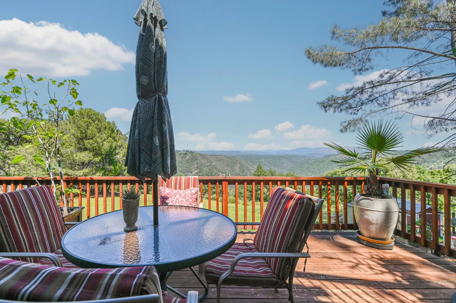 11266 Clinton Bar Road Pine Grove, CA 95665 - Photo 59 of 77 a balcony with wooden floor table and chairs
