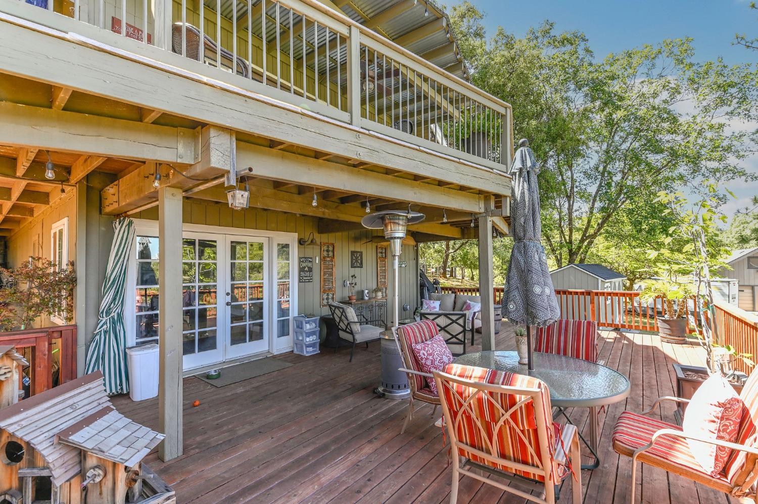 11266 Clinton Bar Road Pine Grove, CA 95665 - Photo 60 of 77 a view of a house with a deck and furniture
