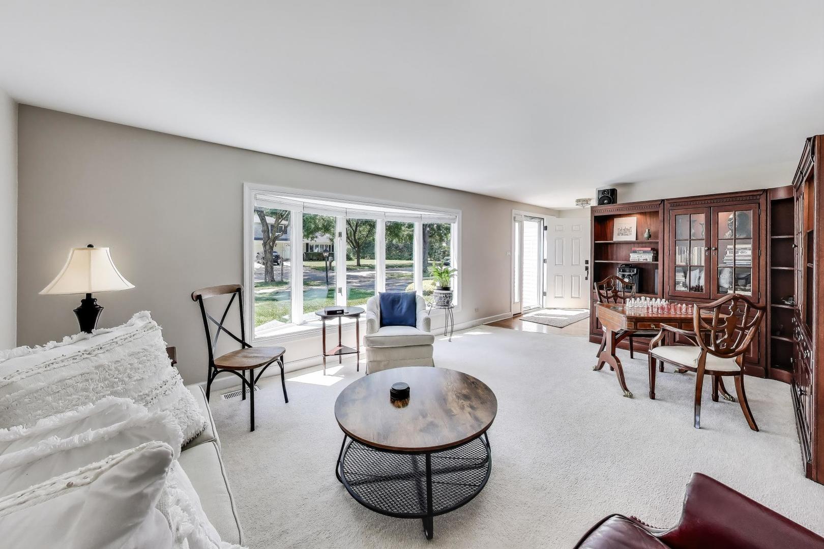1804 East Apache Lane Mount Prospect, IL 60056 - Photo 11 of 27 a living room with furniture and a large window