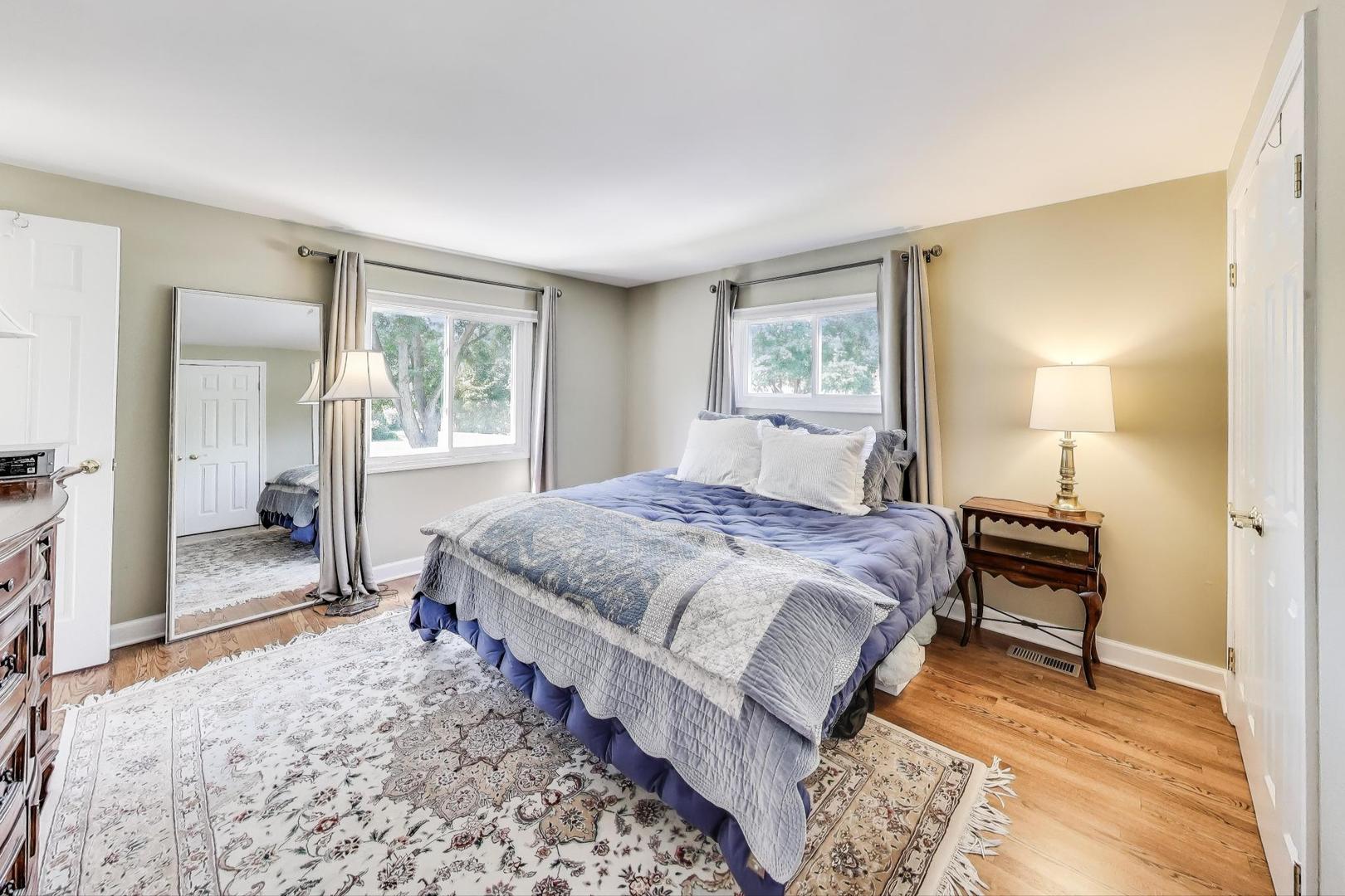 1804 East Apache Lane Mount Prospect, IL 60056 - Photo 12 of 27 a spacious bedroom with a bed and wooden floor