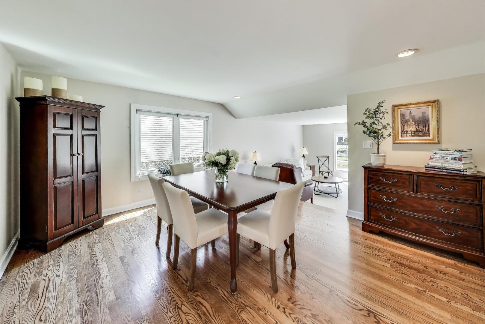 1804 East Apache Lane Mount Prospect, IL 60056 - Photo 5 of 27 a view of a dining room with furniture and wooden floor