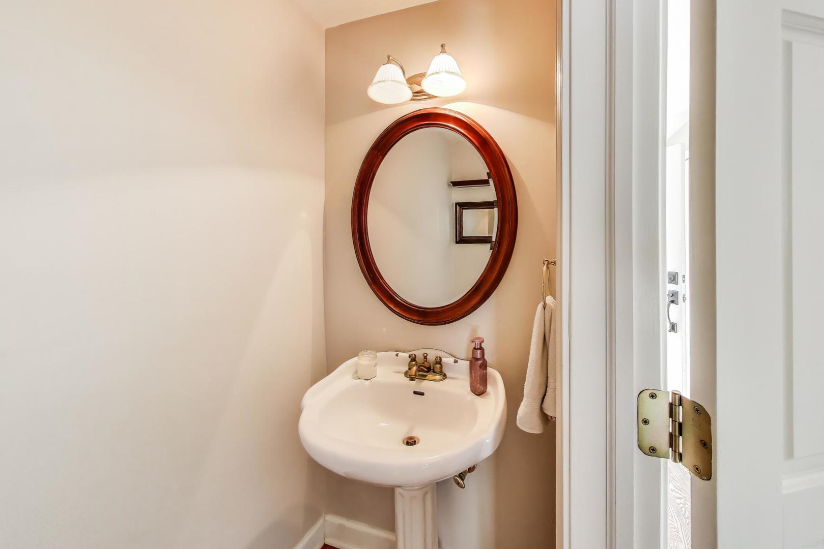 1804 East Apache Lane Mount Prospect, IL 60056 - Photo 9 of 27 a bathroom with a sink and a mirror