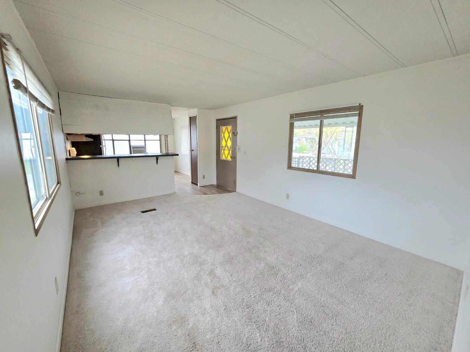 5200 Cavitt Stallman Road, Unit 18 Granite Bay, CA 95746 - Photo 12 of 20 a view of a big room with windows and chandelier