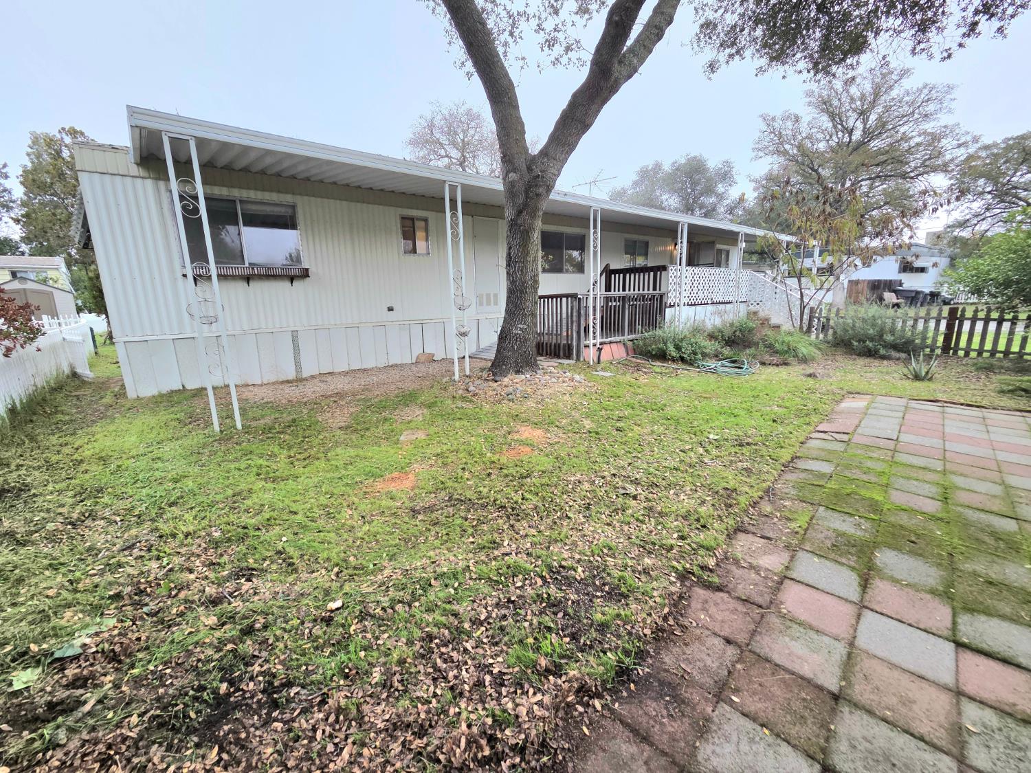 5200 Cavitt Stallman Road, Unit 18 Granite Bay, CA 95746 - Photo 19 of 20 a view of a house with backyard and a garden