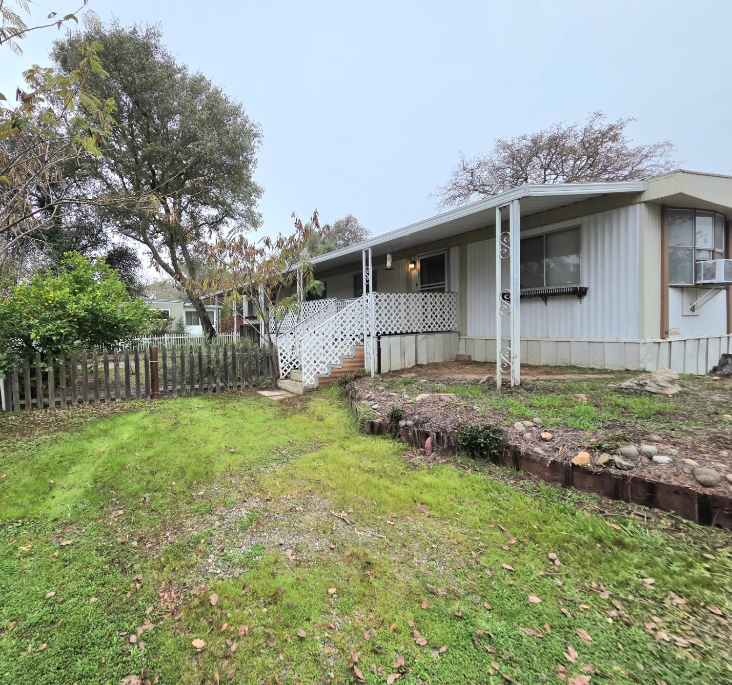 5200 Cavitt Stallman Road, Unit 18 Granite Bay, CA 95746 - Photo 3 of 20 a front view of a house with garden
