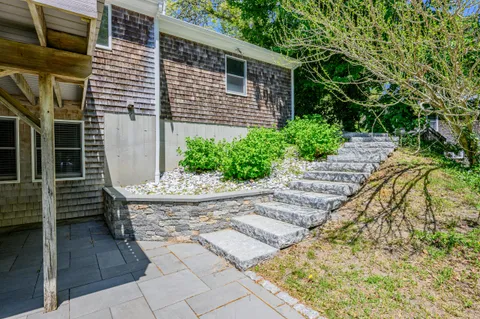 a view of a roof deck with wooden floor and fence
