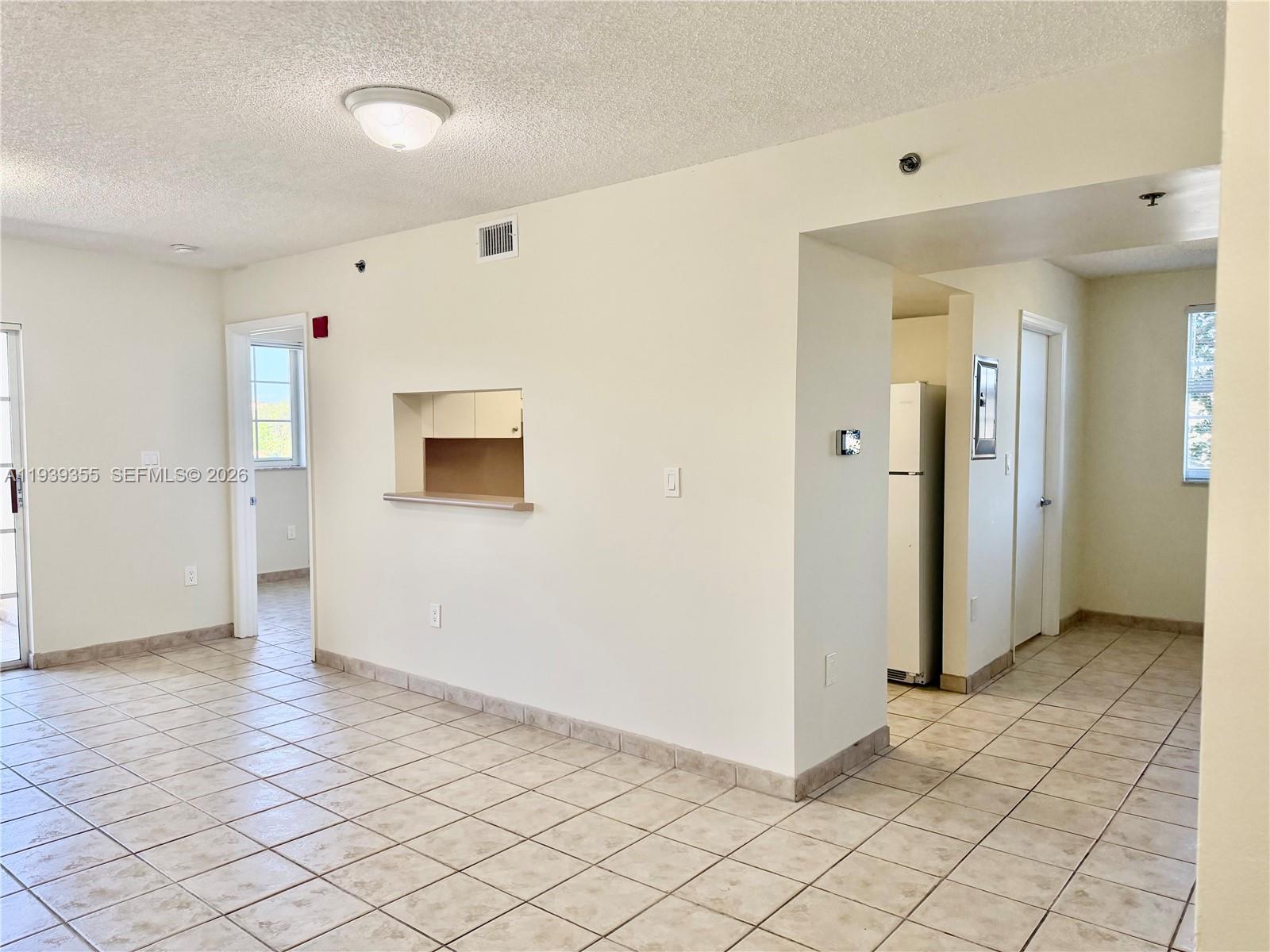 601 Southwest 37th Avenue, Unit 301 Miami, FL 33135 - Photo 11 of 22 a view of a livingroom with wooden floor