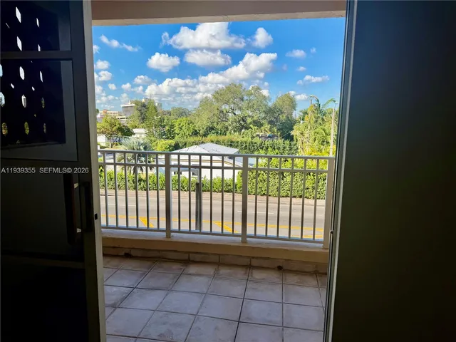 a view of a street from a balcony