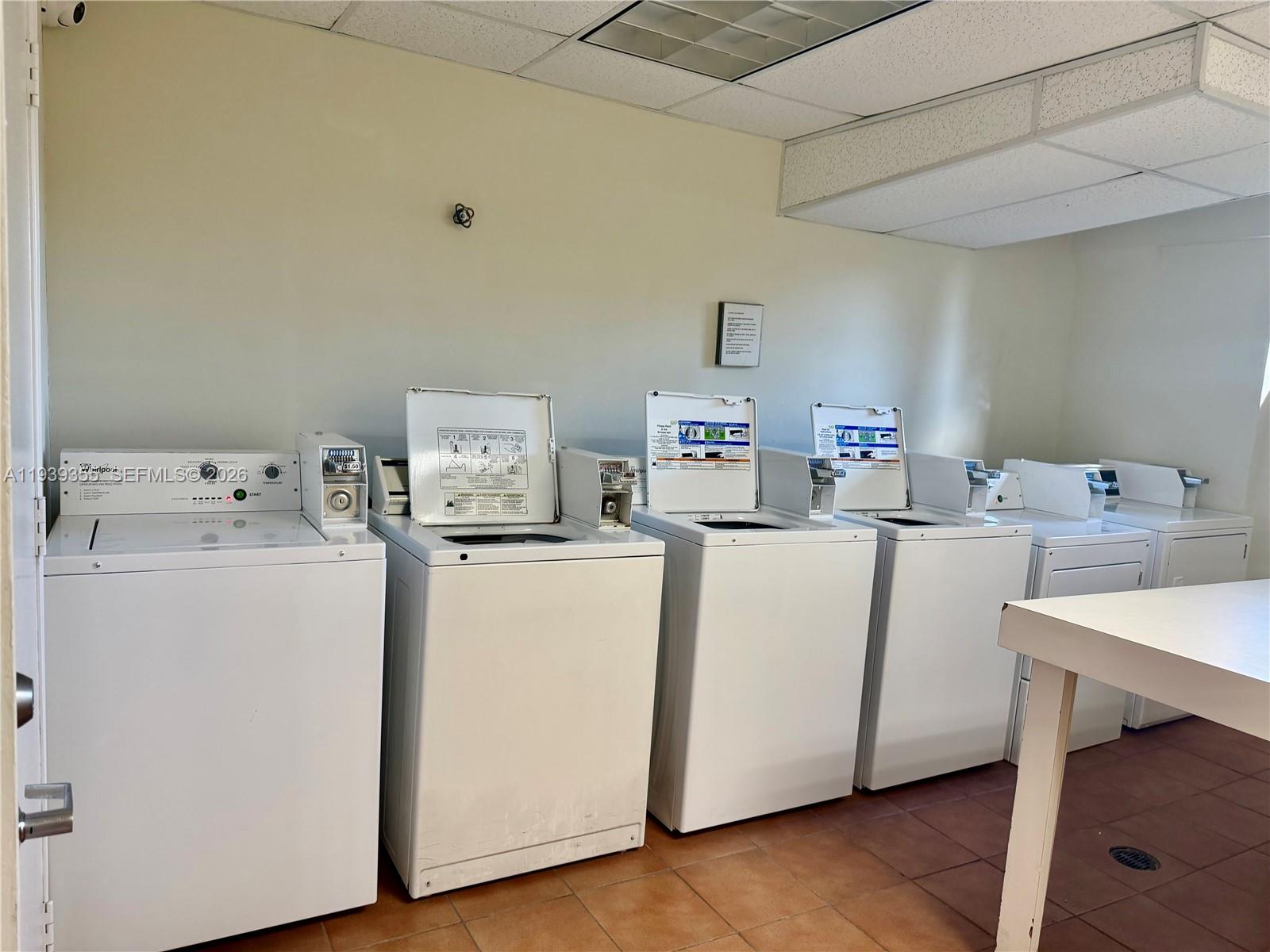 601 Southwest 37th Avenue, Unit 301 Miami, FL 33135 - Photo 18 of 22 a utility room with dryer and washer