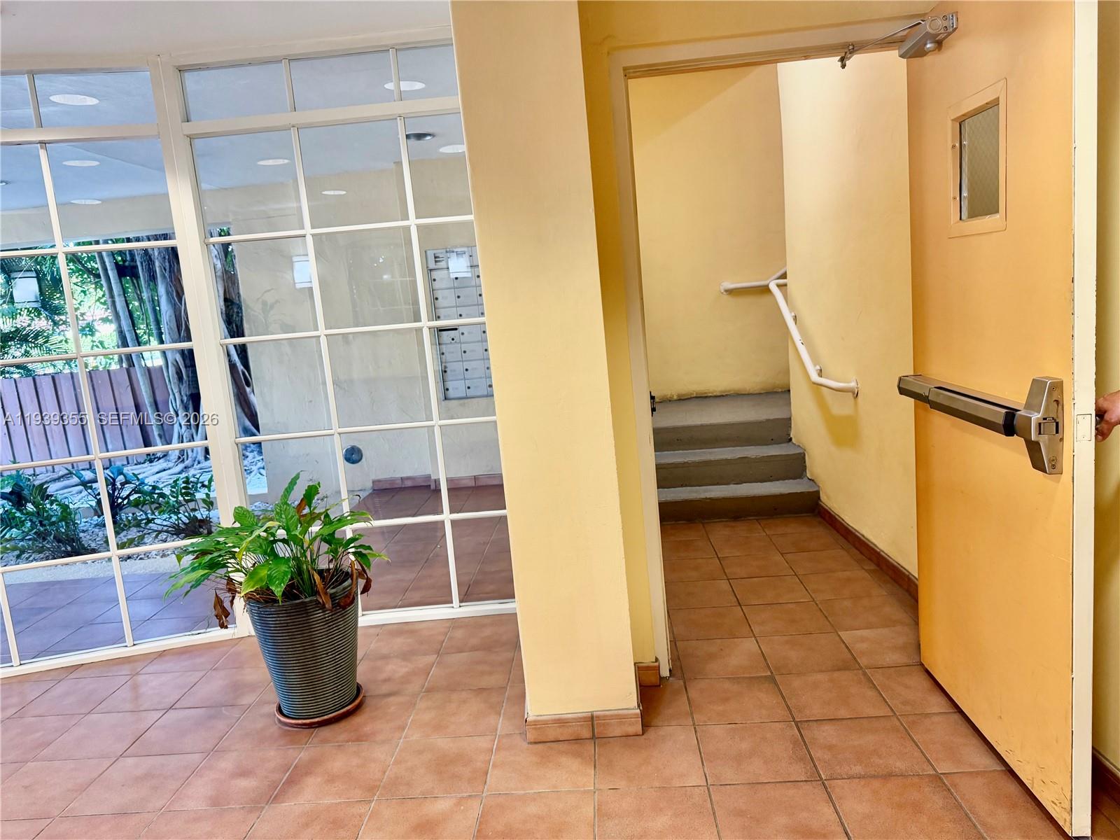 601 Southwest 37th Avenue, Unit 301 Miami, FL 33135 - Photo 5 of 22 a view of entryway with a flower pot