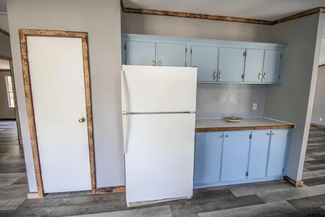 a white refrigerator freezer sitting inside of a kitchen