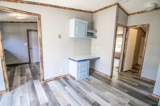 a view of a kitchen from the hallway