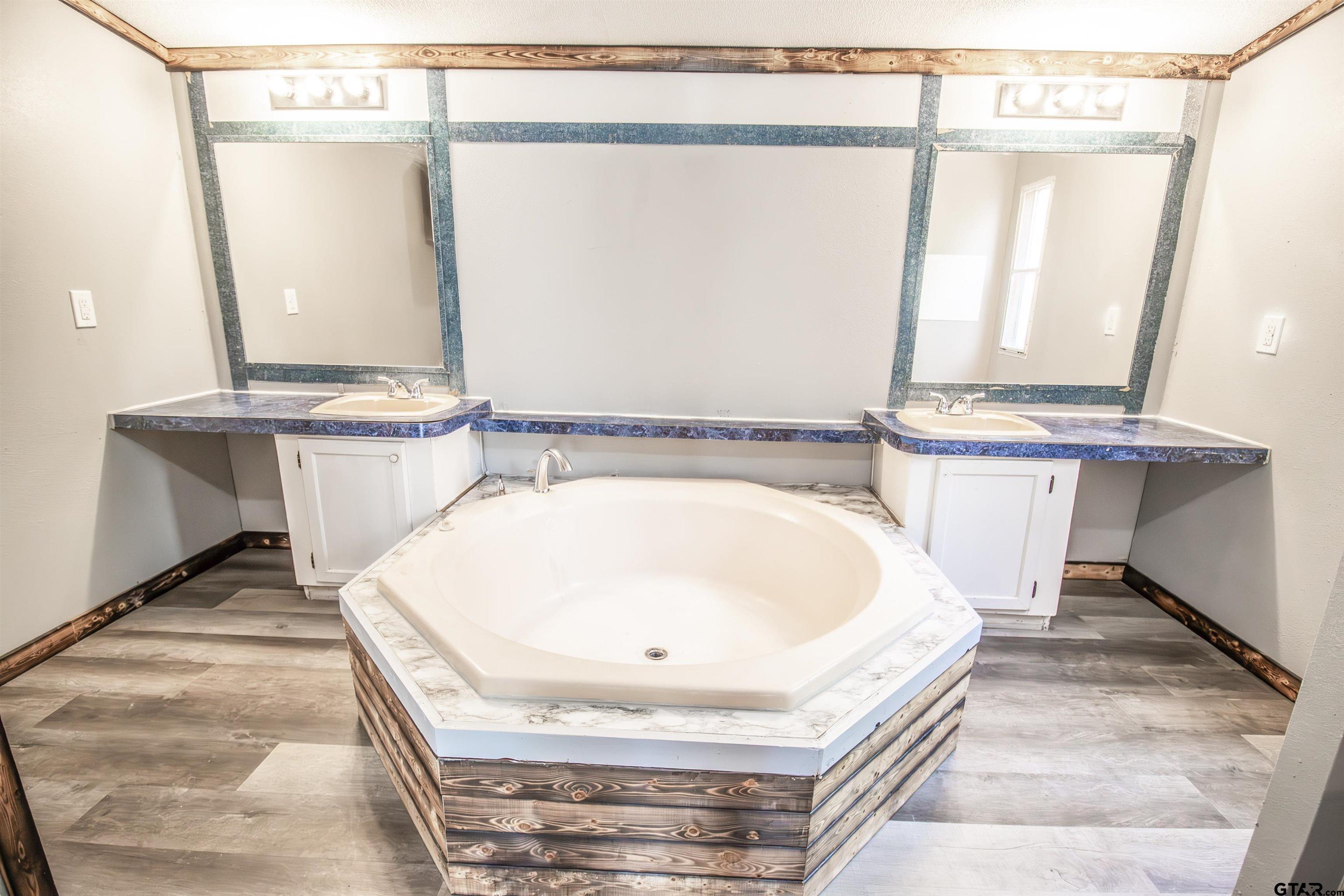 12450 Fannin Parkway Tyler, TX 75708 - Photo 19 of 39 a bathroom with a sink and a mirror