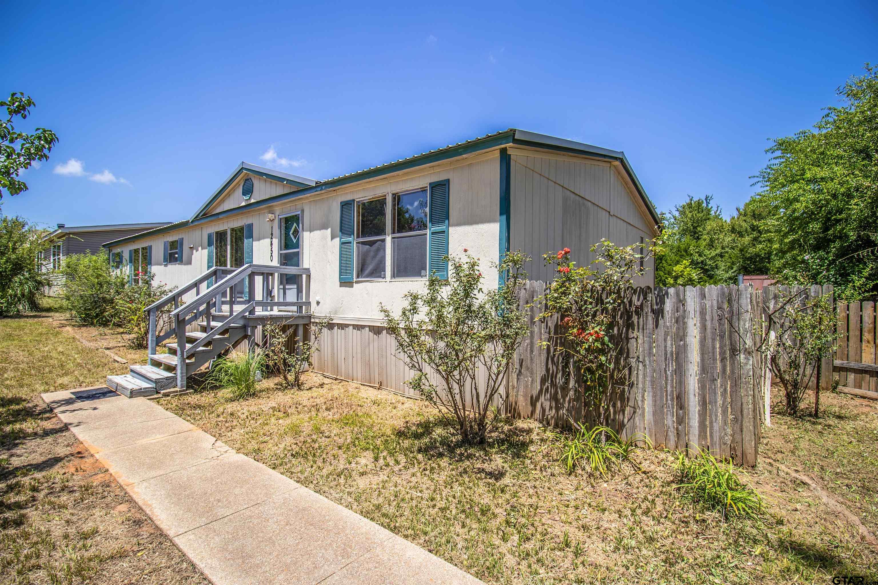12450 Fannin Parkway Tyler, TX 75708 - Photo 2 of 39 a view of a house with a yard