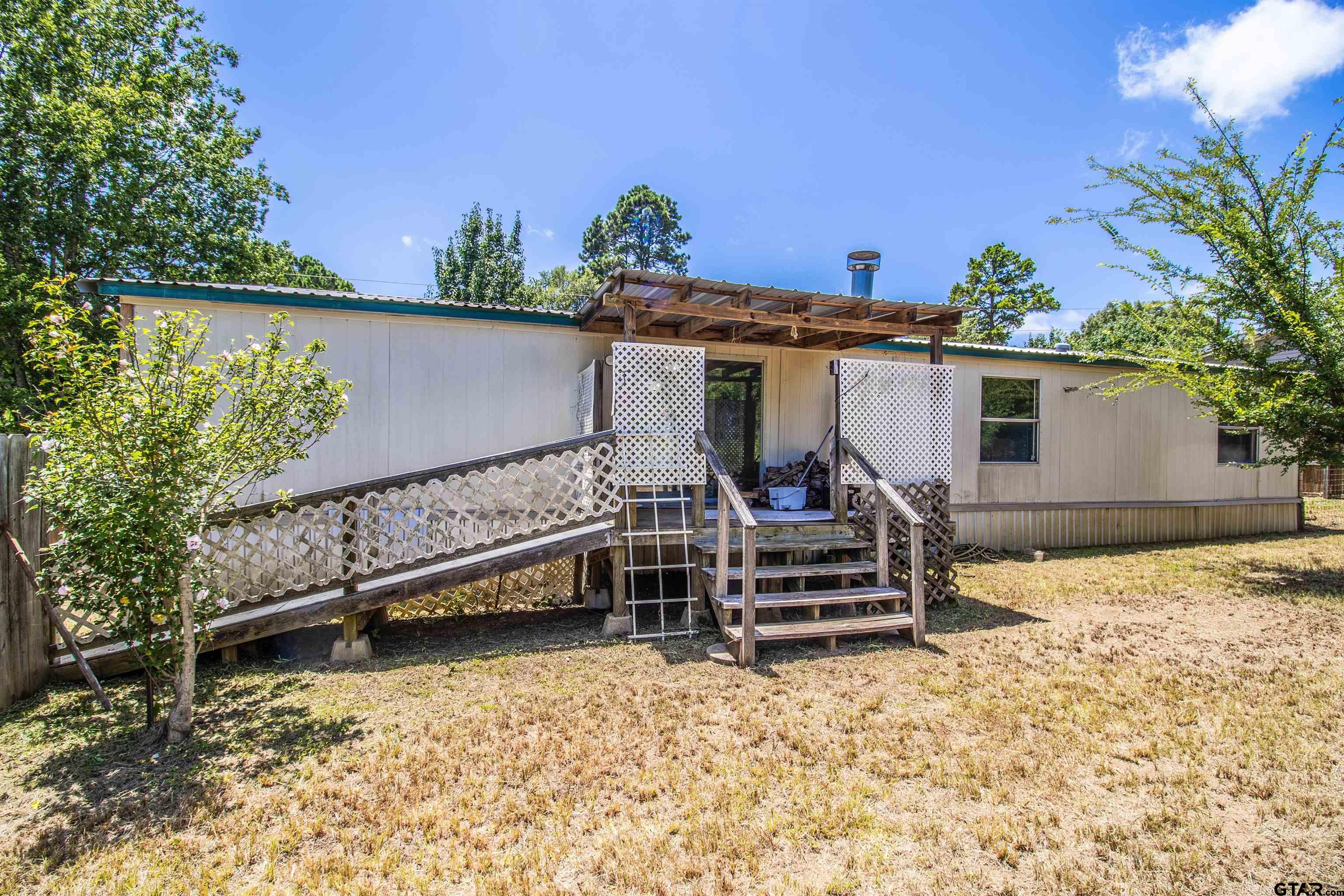 12450 Fannin Parkway Tyler, TX 75708 - Photo 28 of 39 front view of a house with a yard