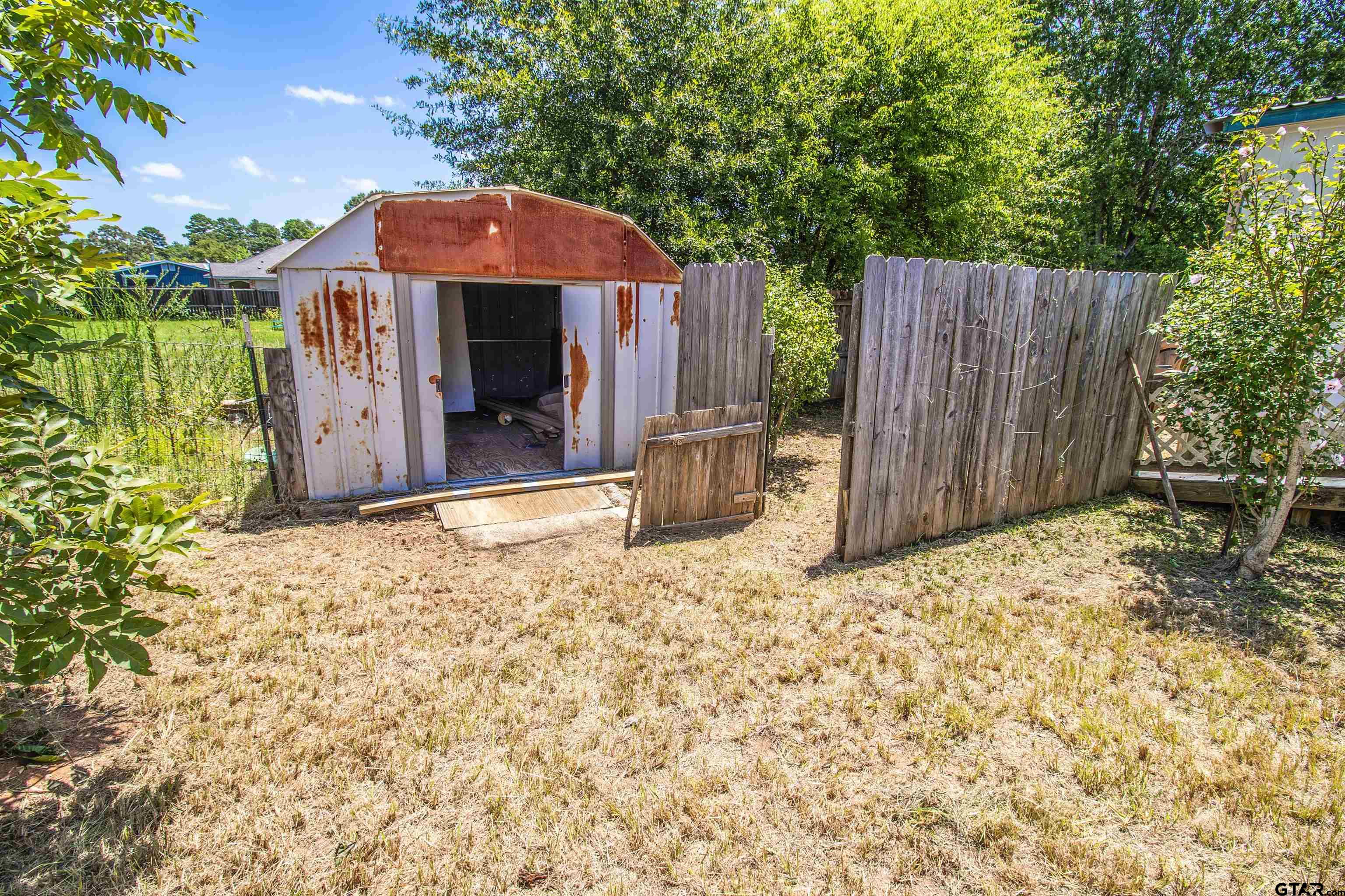12450 Fannin Parkway Tyler, TX 75708 - Photo 30 of 39 a front view of a house with a yard