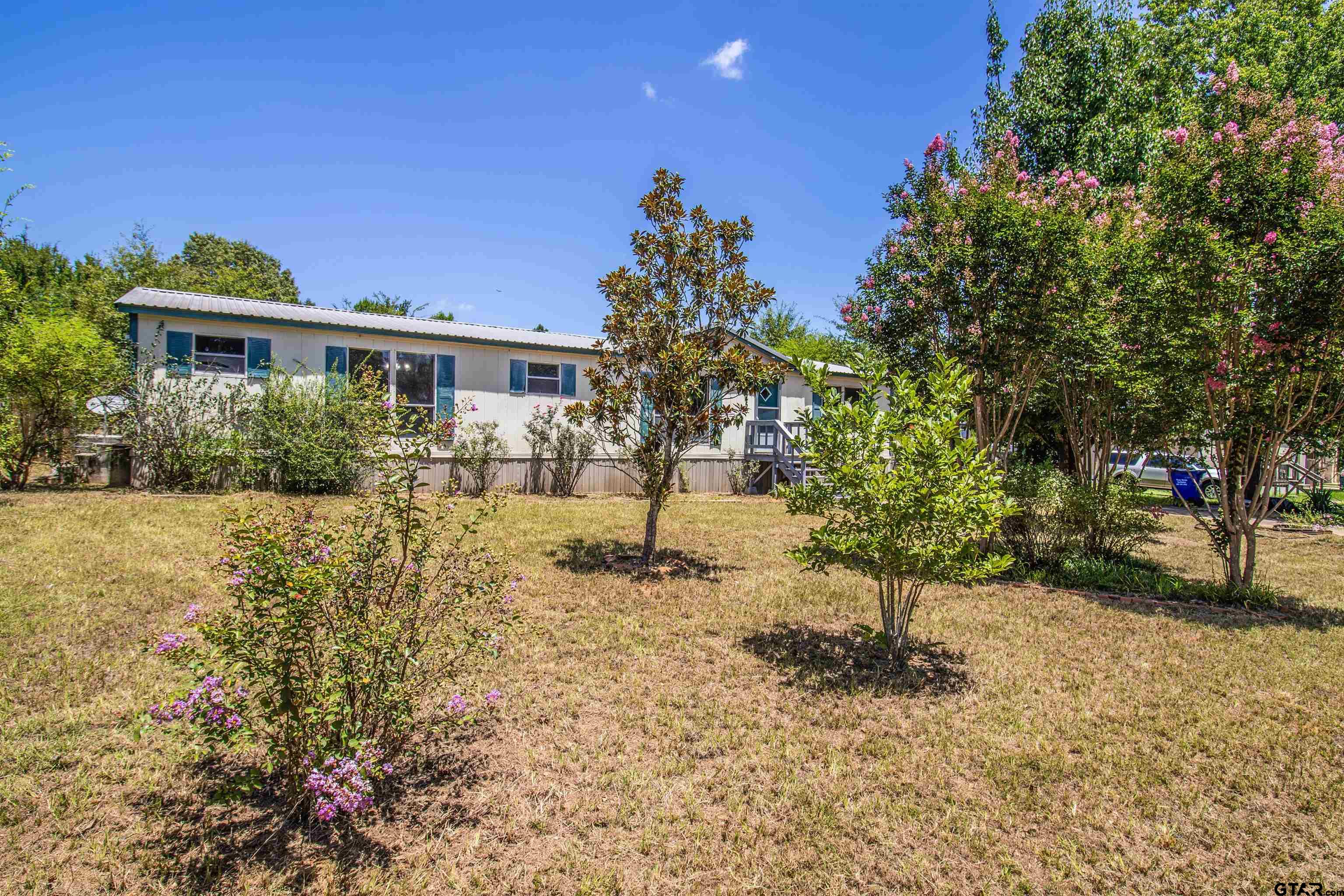 12450 Fannin Parkway Tyler, TX 75708 - Photo 32 of 39 a view of a yard in front of house