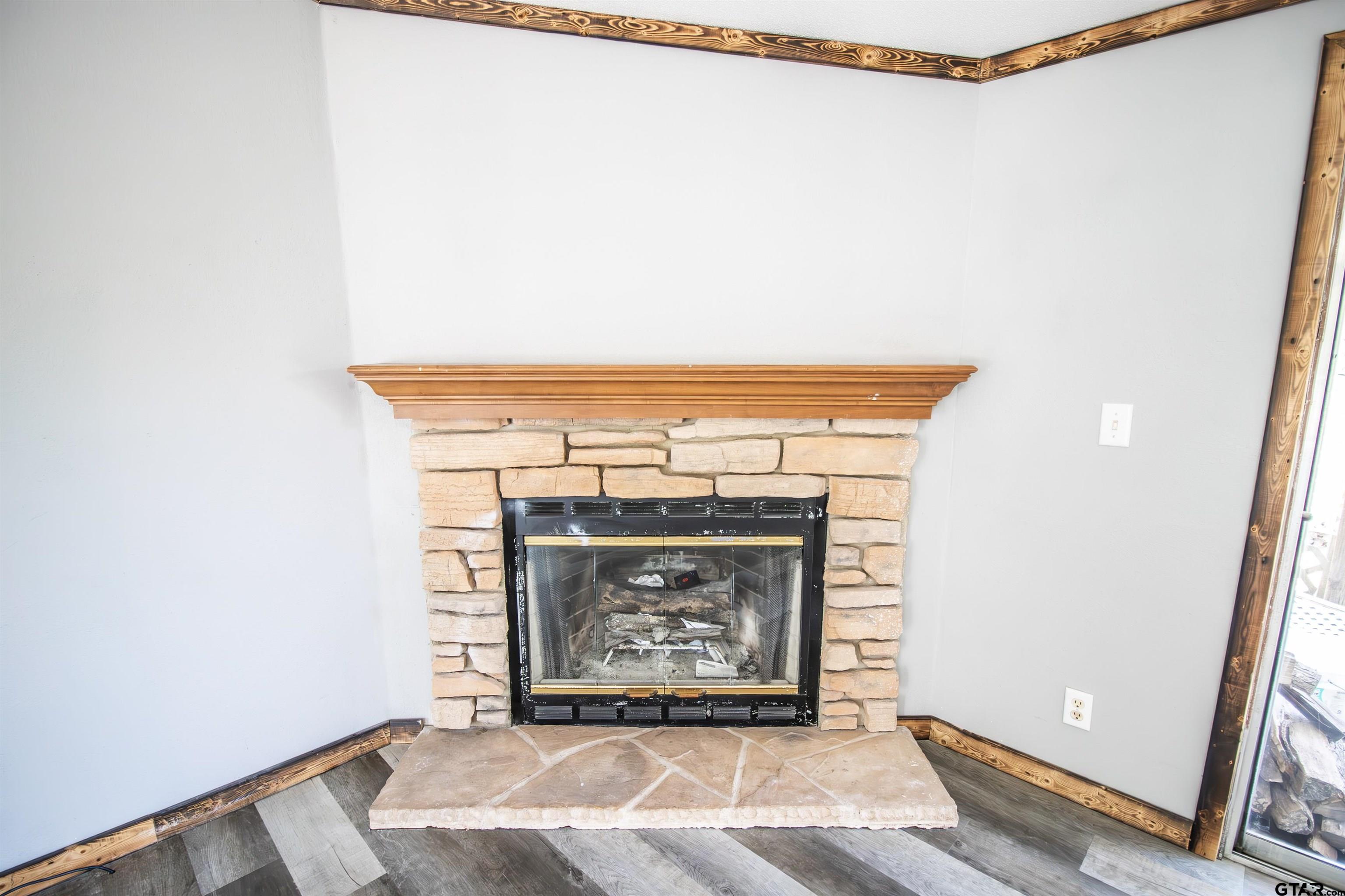 12450 Fannin Parkway Tyler, TX 75708 - Photo 7 of 39 a view of an empty room with wooden floor