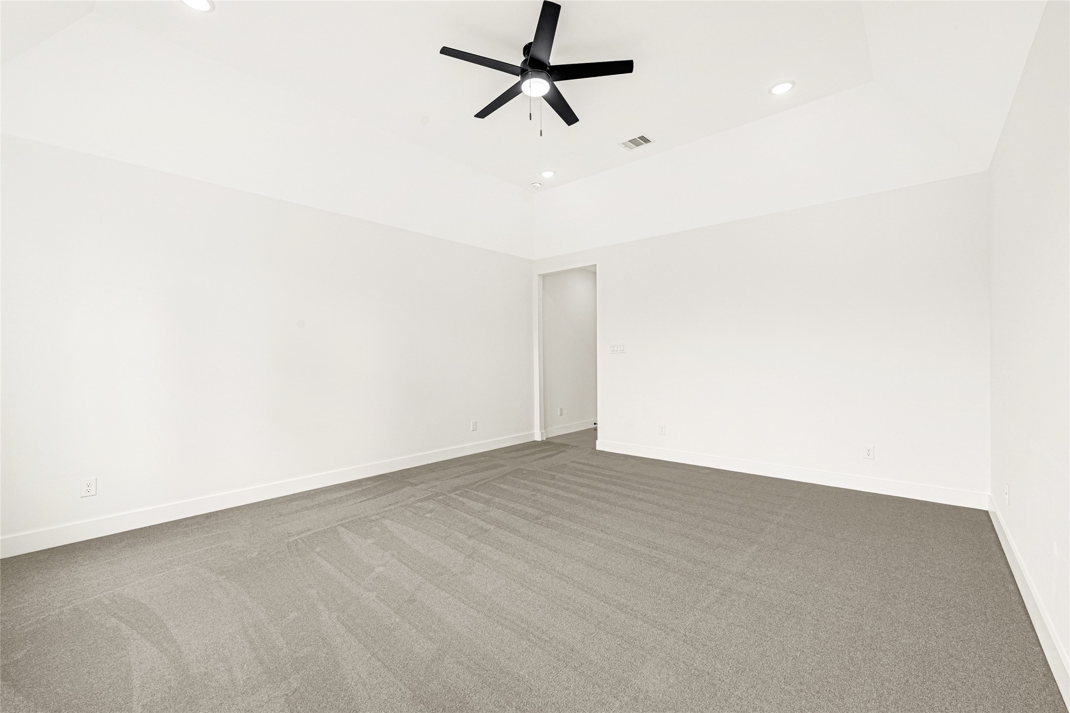 16915 Hamill Drive Rosharon, TX 77583 - Photo 37 of 47 an empty room with a ceiling fan and carpet