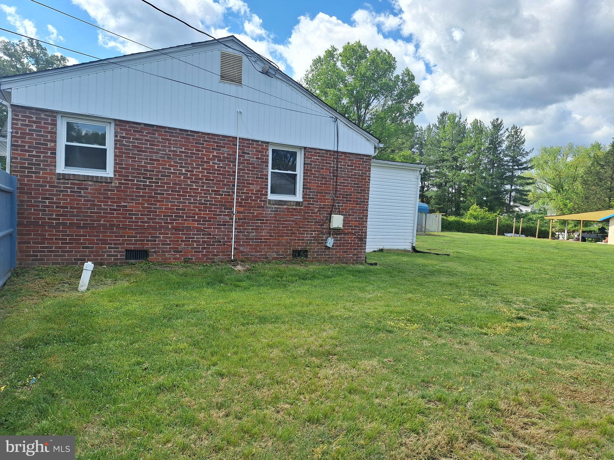 8816 Cooper Road Alexandria, VA 22309 - Photo 11 of 52 a backyard of a house with lots of green space