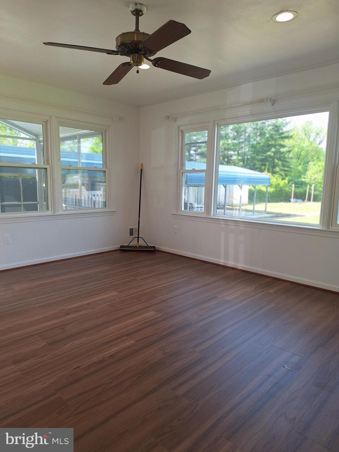 8816 Cooper Road Alexandria, VA 22309 - Photo 20 of 52 a view of an empty room with wooden floor and a window