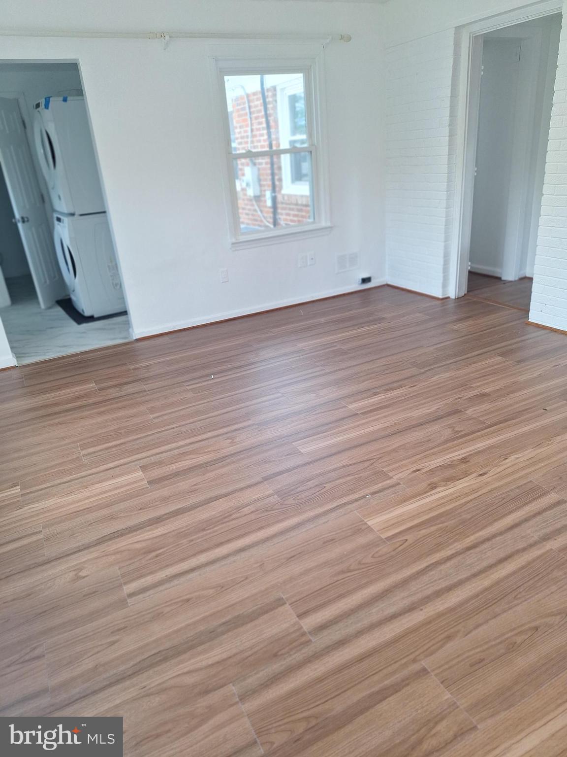 8816 Cooper Road Alexandria, VA 22309 - Photo 22 of 52 an empty room with wooden floor and windows