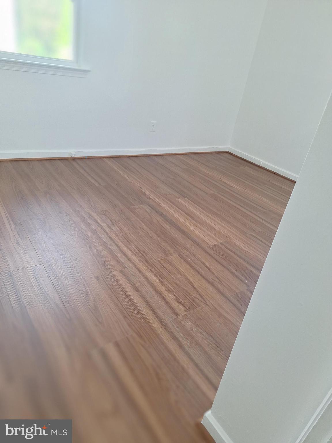 8816 Cooper Road Alexandria, VA 22309 - Photo 23 of 52 an empty room with wooden floor