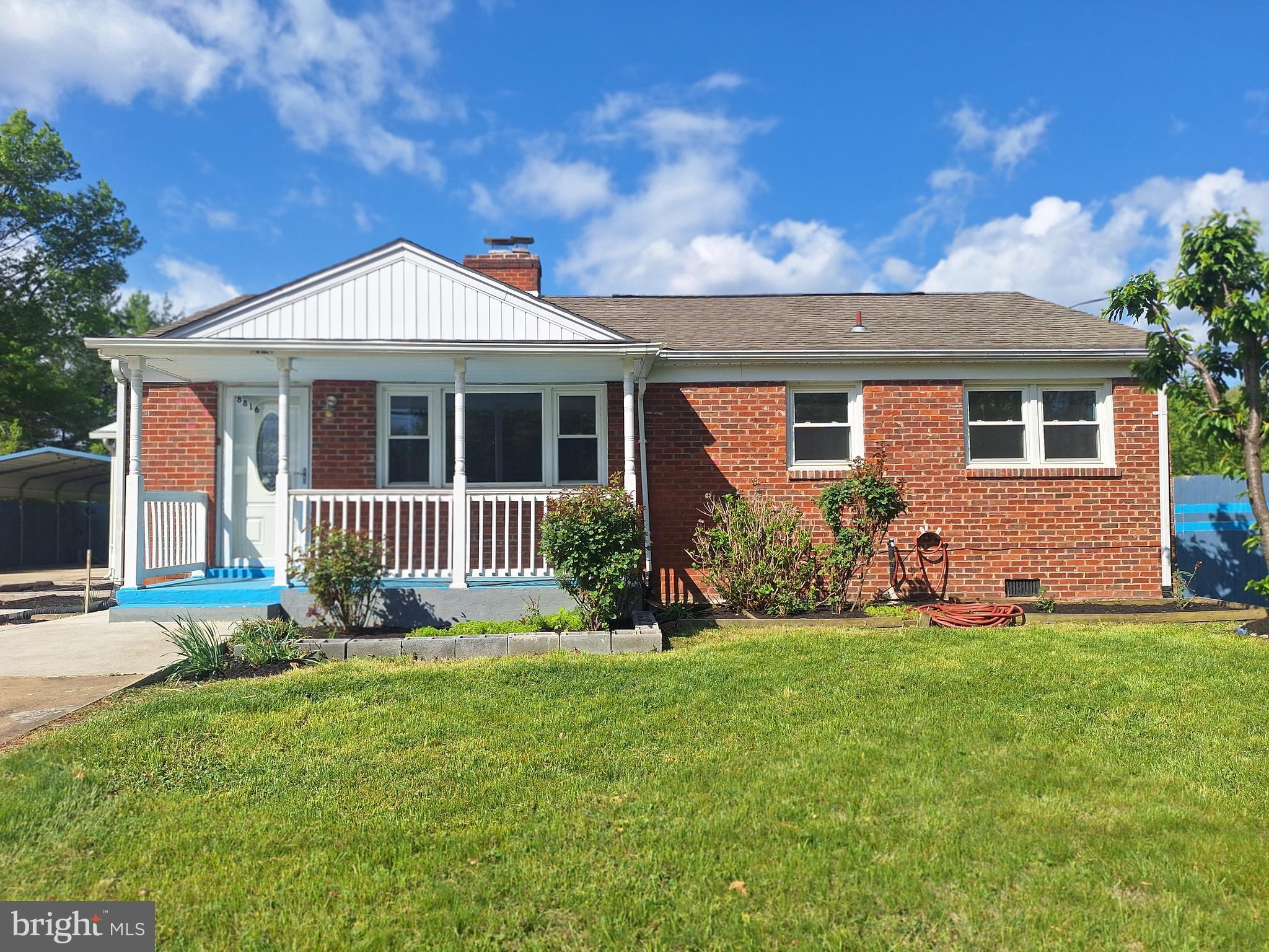 8816 Cooper Road Alexandria, VA 22309 - Photo 37 of 52 front view of a house with a yard