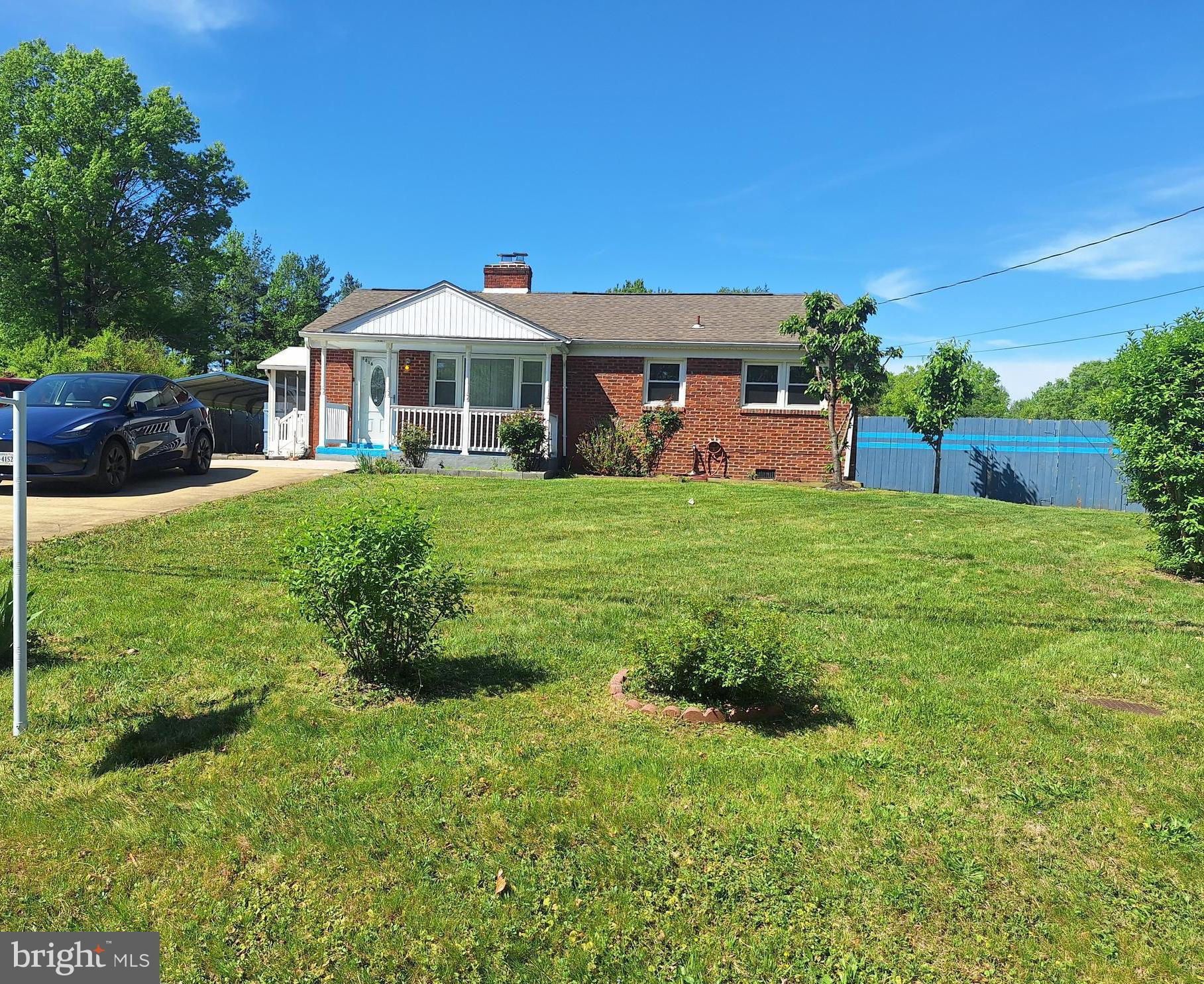 8816 Cooper Road Alexandria, VA 22309 - Photo 38 of 52 a front view of a house with garden