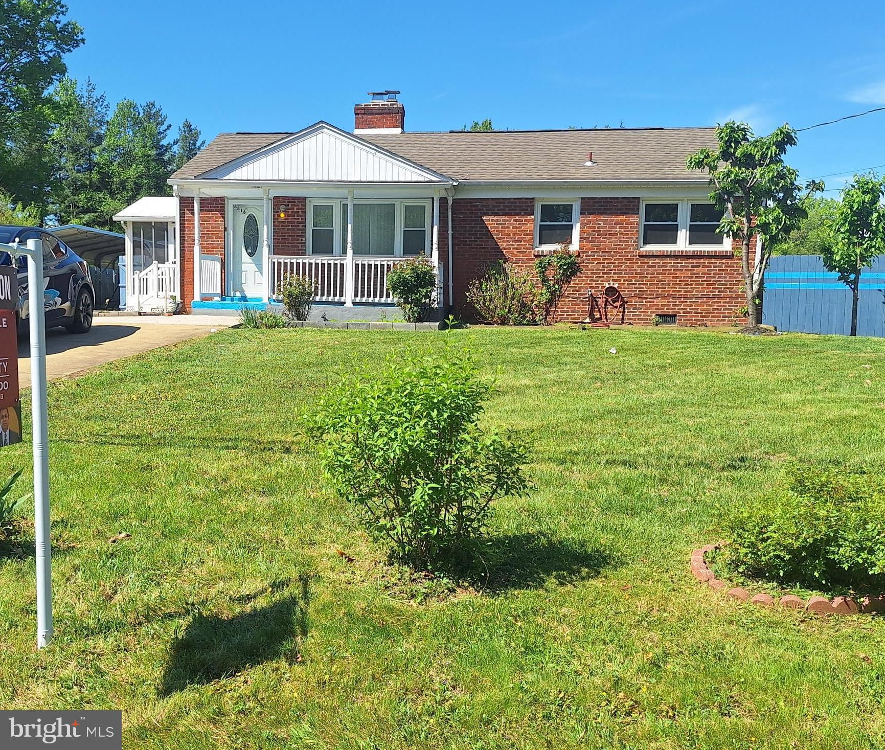 8816 Cooper Road Alexandria, VA 22309 - Photo 41 of 52 a front view of a house with garden