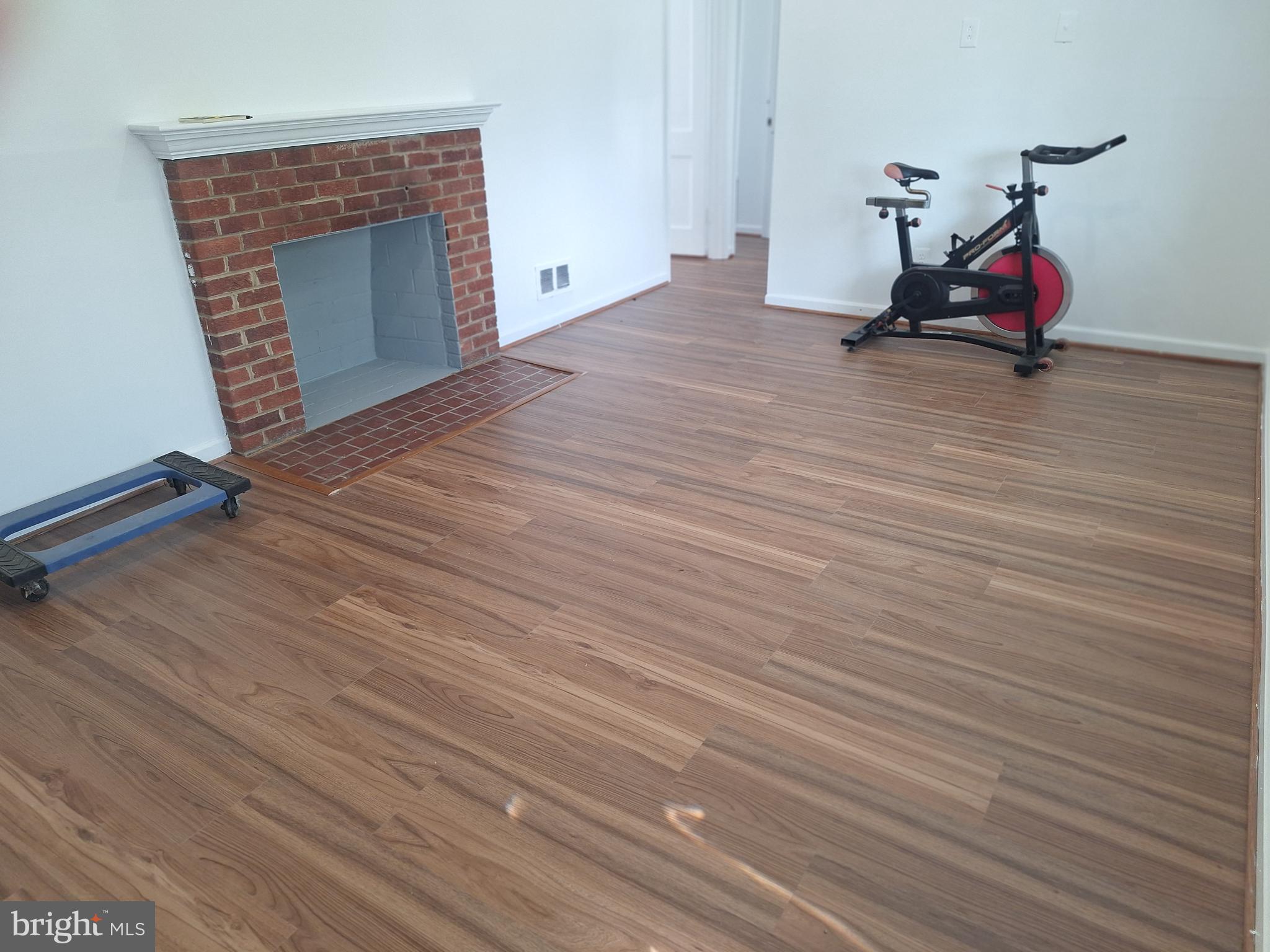 8816 Cooper Road Alexandria, VA 22309 - Photo 49 of 52 wooden floor and chair in a room with wooden floor