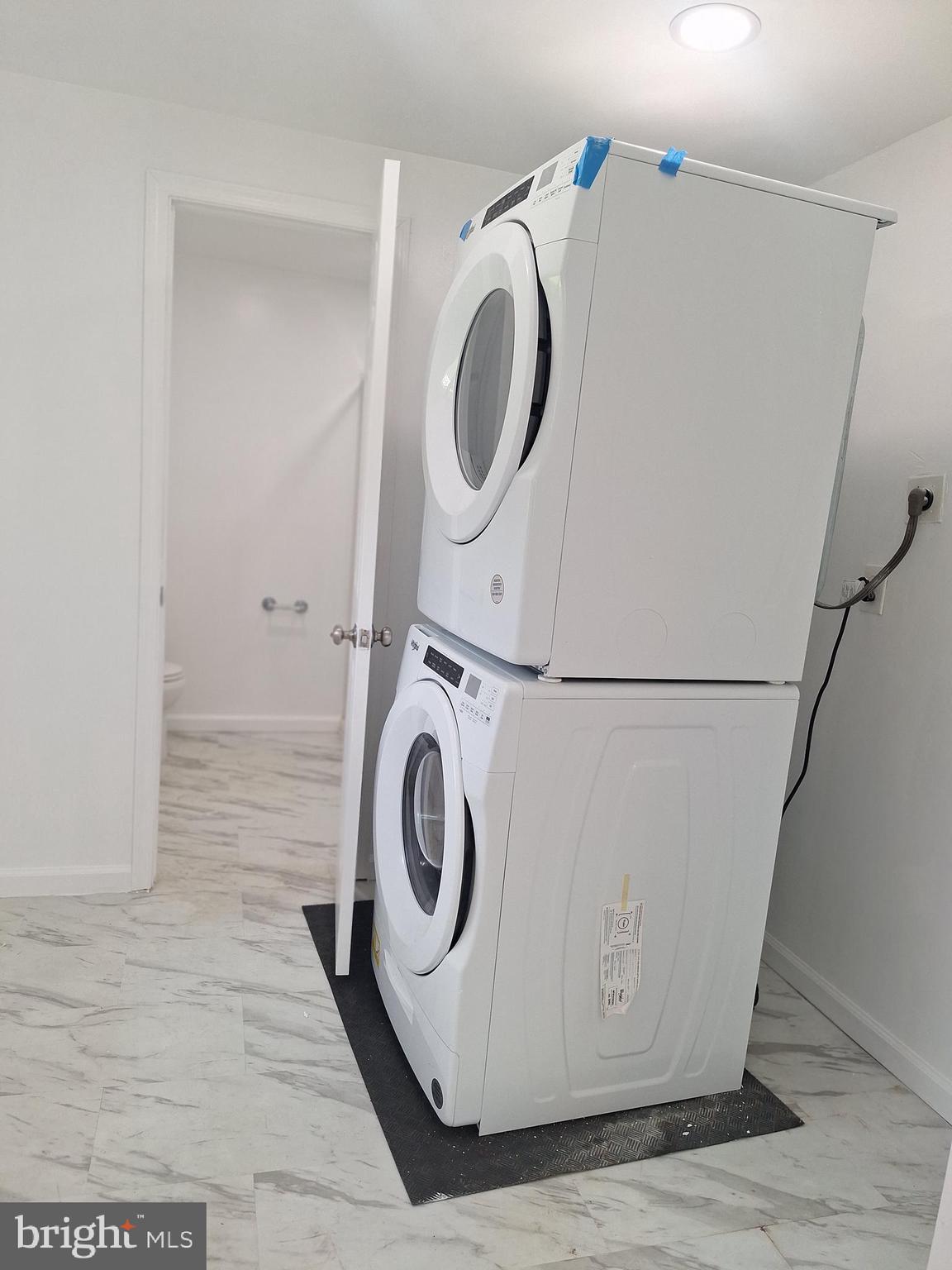 8816 Cooper Road Alexandria, VA 22309 - Photo 6 of 52 a utility room with dryer and washer