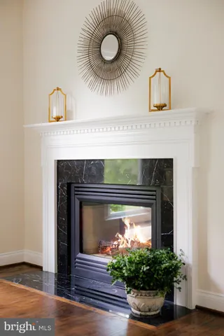 a close view of a fireplace with wooden floor