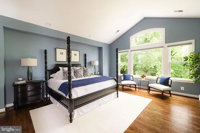 a bed room with a bed and a couch