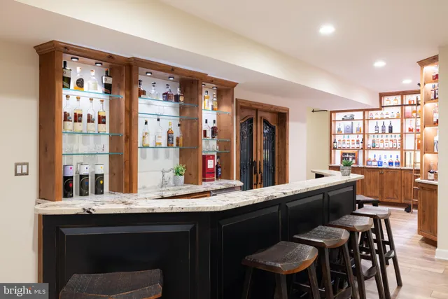 a kitchen with a table and chairs in it