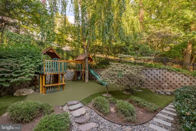 an aerial view of a house with swimming pool and furniture